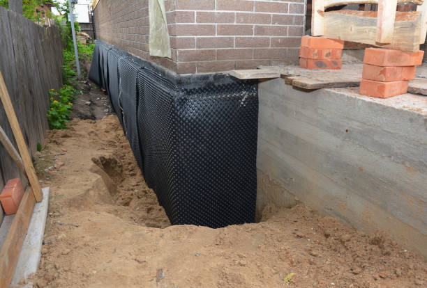 SJ Waterproofing Pros technician performing targeted Waterproofing assessment in Grady, AL